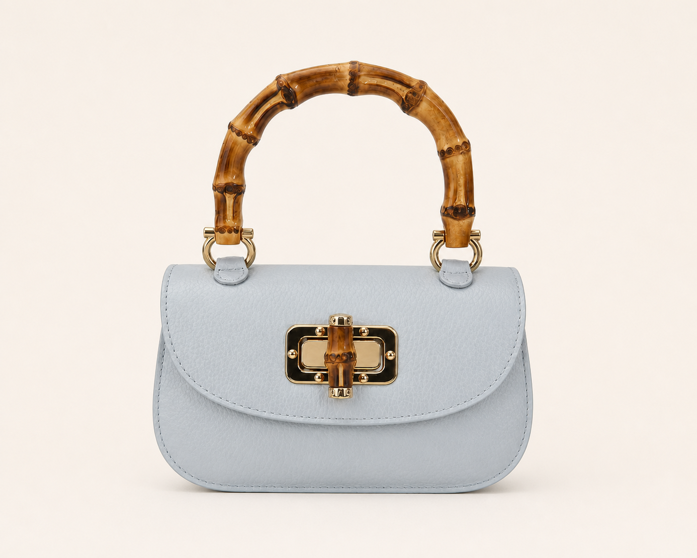 Pitti Mini — straight-on front view with natural leather texture
